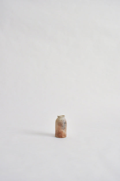 tiny wheel thrown vase, fired in a pit