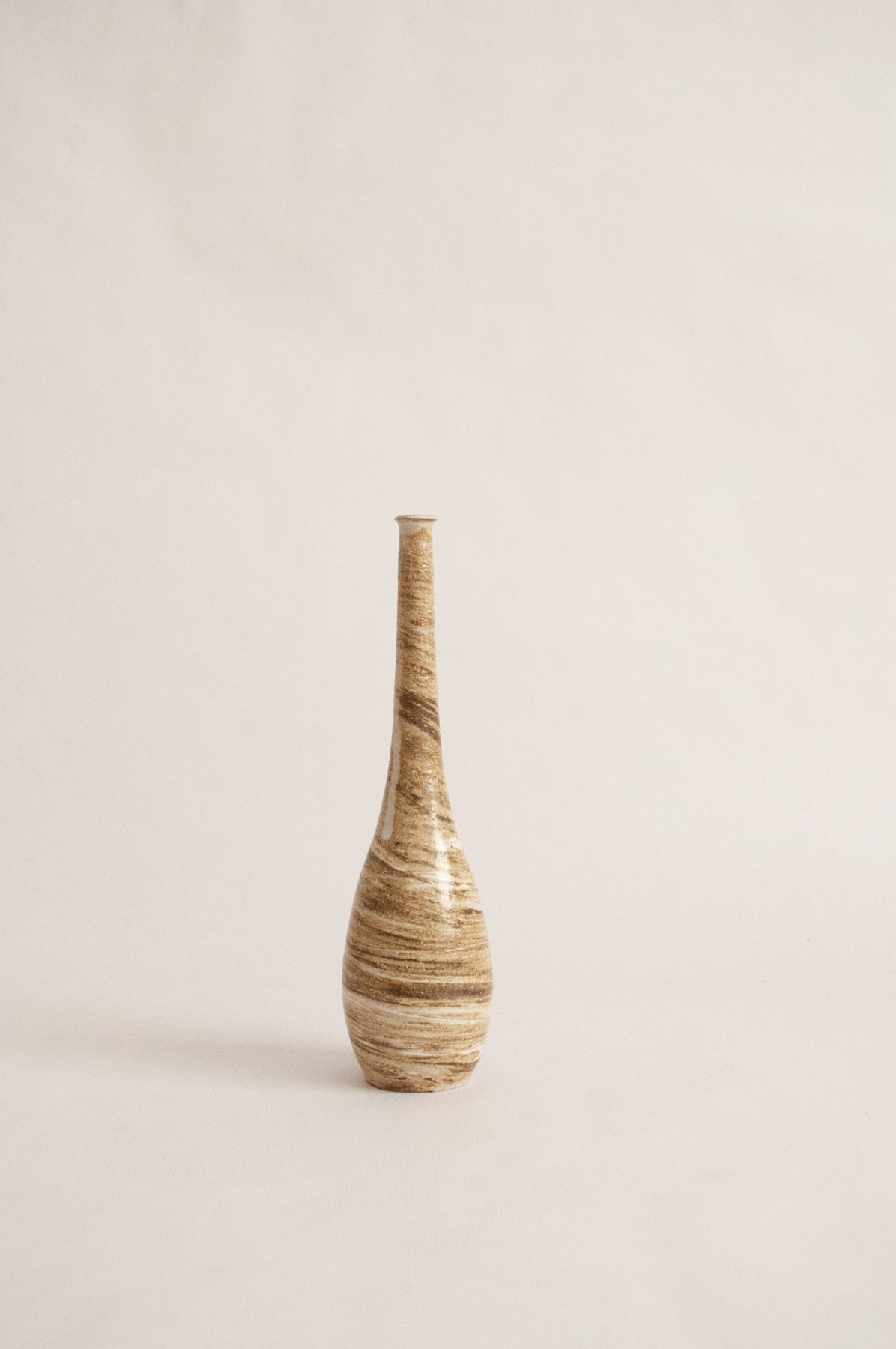 wheel-thrown, marbled beige clay vase