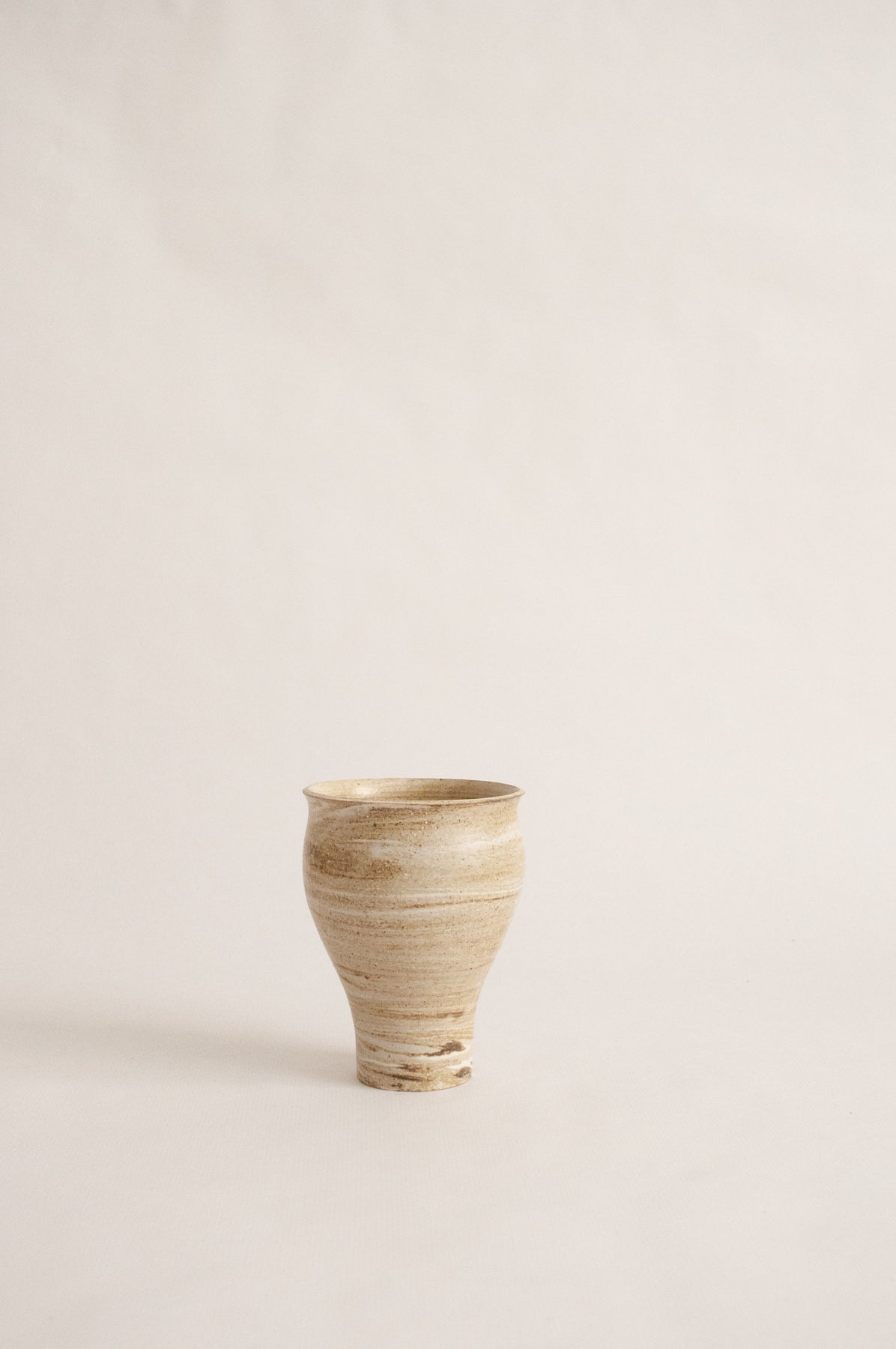 wheel-thrown, marbled beige clay vase