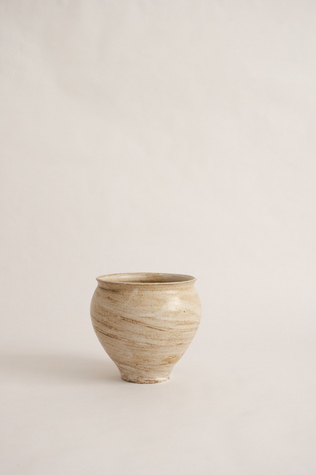 wheel-thrown, marbled beige clay vase