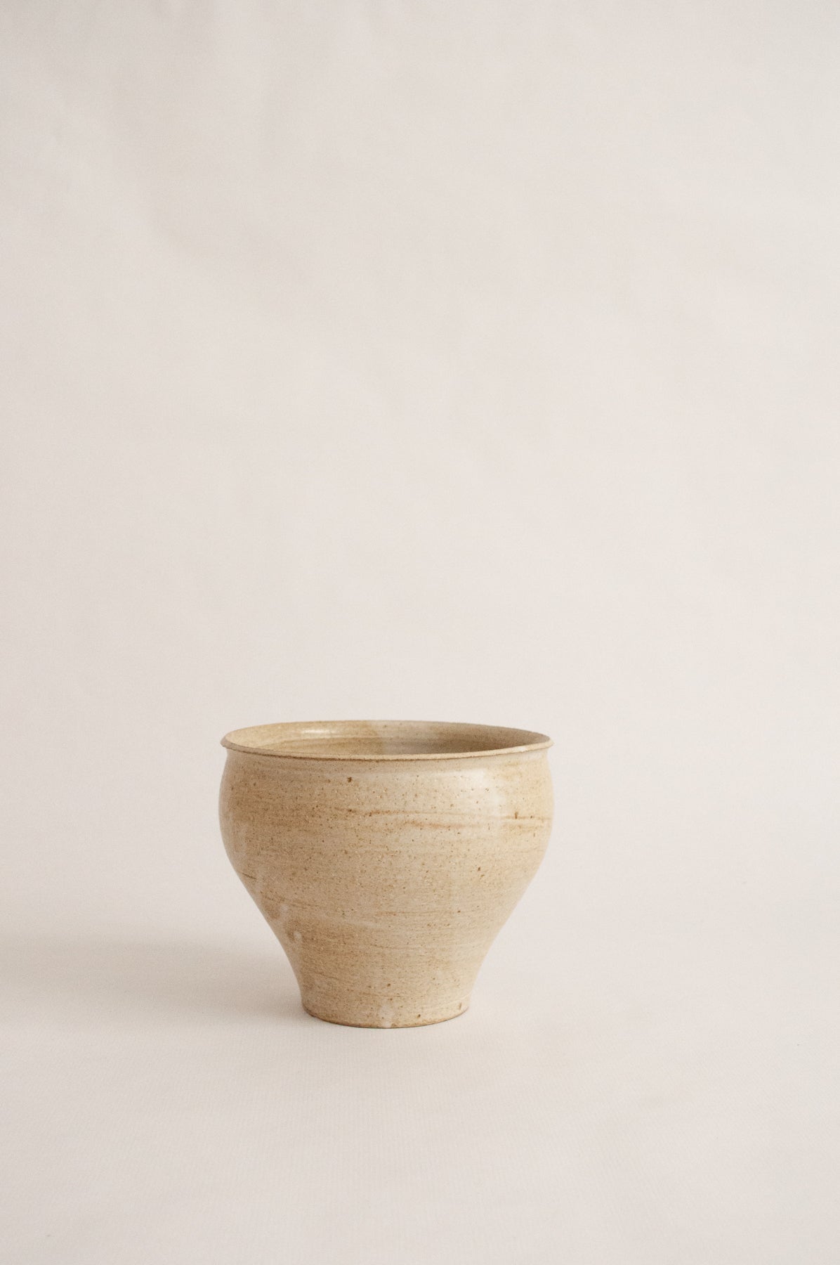 wheel-thrown, marbled beige clay vase